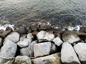 High angle view of stones on beach