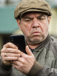 Portrait of man using mobile phone