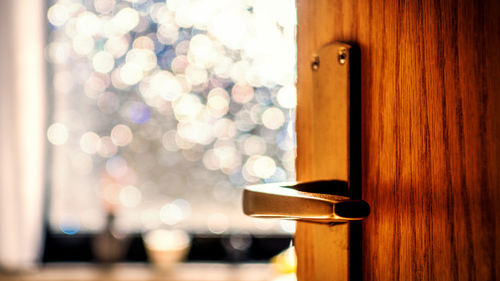 Close-up of door against lens flare