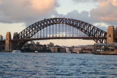 View of bridge over sea against cloudy sky