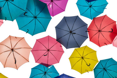 Low angle view of umbrellas hanging on clothesline