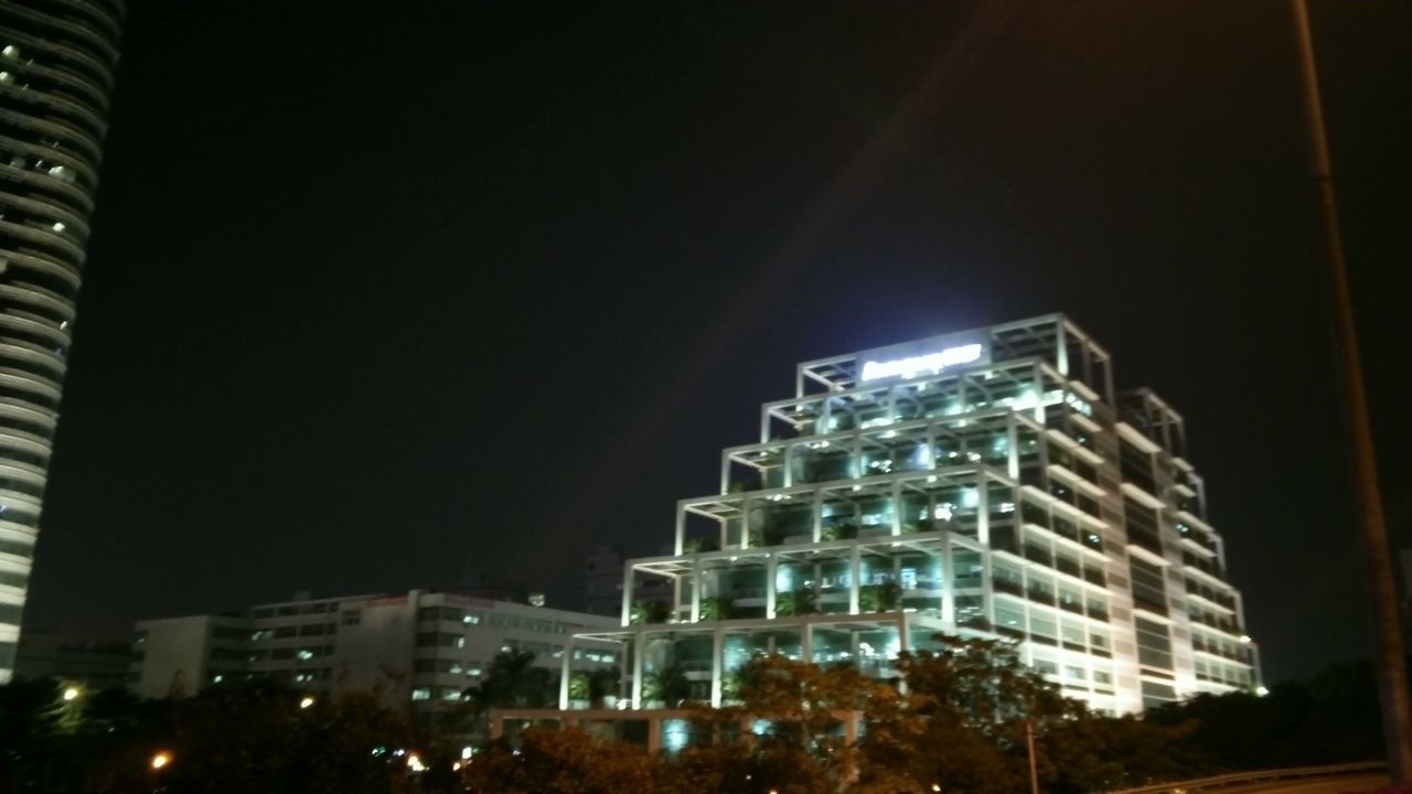 illuminated, night, architecture, built structure, building exterior, city, low angle view, modern, skyscraper, clear sky, copy space, lighting equipment, sky, cityscape, building, tall - high, office building, light - natural phenomenon, glowing, tower