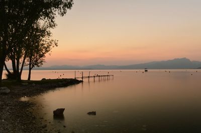 Scenic view of sea against sky at sunset