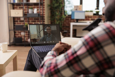 Woman using laptop at home