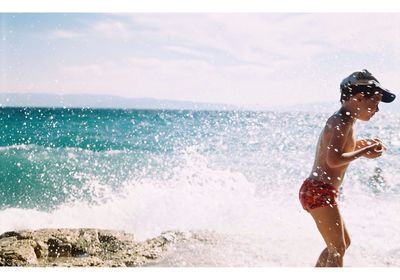 Woman jumping on beach