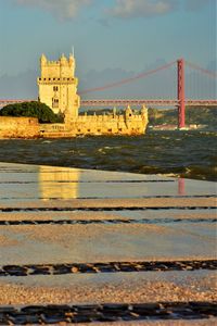View of golden gate bridge over river against sky