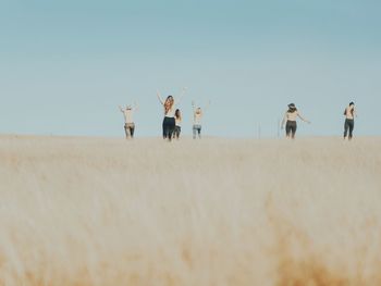 Full length of woman standing on landscape