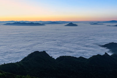 Scenic view of silhouette mountains against sky during sunset