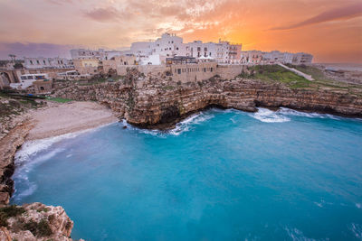 Sunset in polignano a mare, puglia region in southern italy