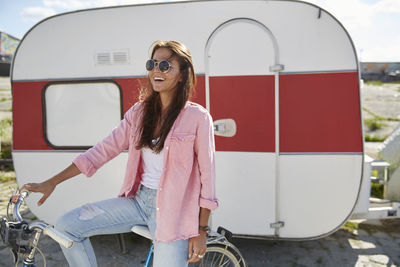 Young woman standing in front of food truck