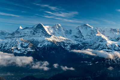 Scenic view of snowcapped mountains against sky