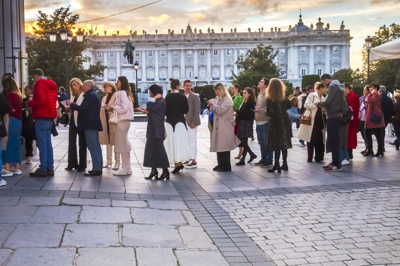 crowd, group of people, architecture, large group of people, city, building exterior, men, built structure, women, tourism, adult, street, nature, celebration, travel destinations, sky, city life, full length, outdoors, travel, person, walking, event