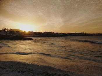 Scenic view of river against sky during sunset