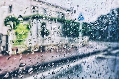 Full frame shot of wet glass window in rainy season