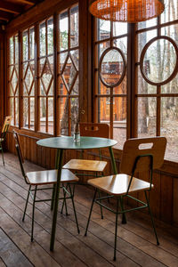 Empty chairs and tables in restaurant