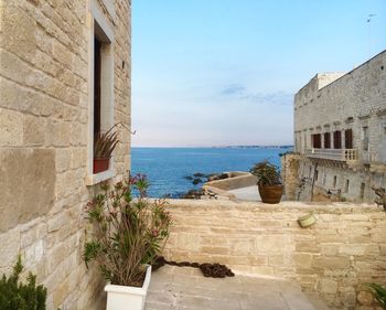 View of calm sea against clear blue sky