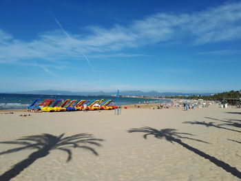 Scenic view of beach against blue sky
