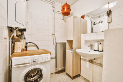 High angle view of man washing in bathroom