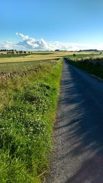 Road passing through field