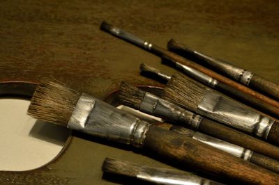 Close-up of paintbrushes on table