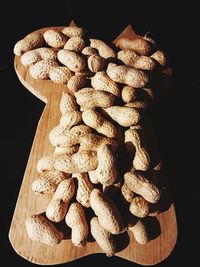 High angle view of bread on table against black background