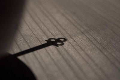 Close-up of shadow on table