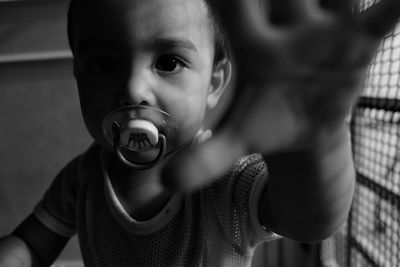 Close-up portrait of cute boy playing