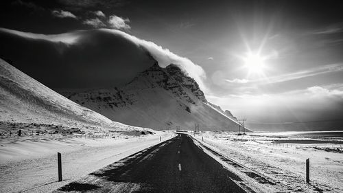 Scenic view of snow covered mountains against sky