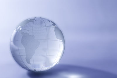 Close-up of crystal ball against white background