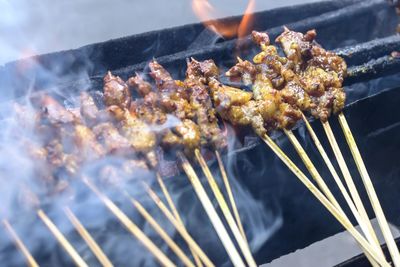 High angle view of meat on barbecue grill