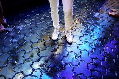 Low section of woman standing on floor