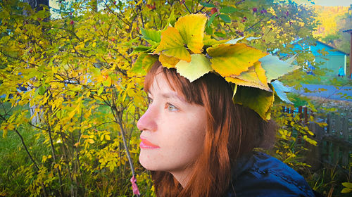 Close-up of autumn leaves on woman hair at park