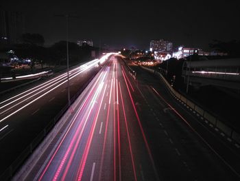 High angle view of light trails on road at night