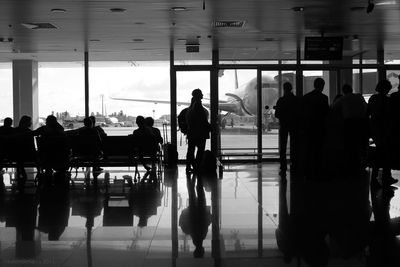 Silhouette people waiting at airport