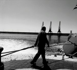 Full length of woman standing against clear sky
