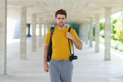 Portrait of young man standing outdoors