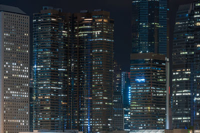 Illuminated buildings in city at night