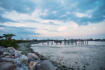 Scenic view of beach against sky during sunset