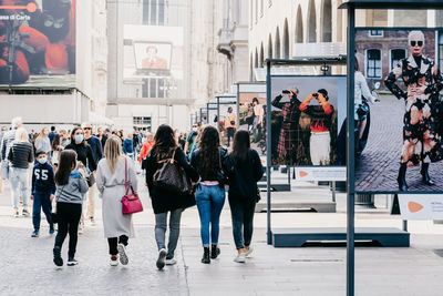 People walking on street in city