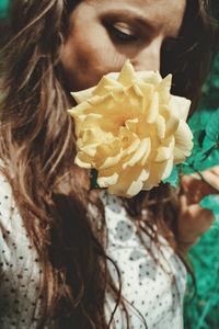 Close-up of woman holding rose