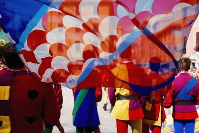 Multi colored flags against sky