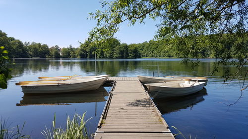 Boats moored in lake