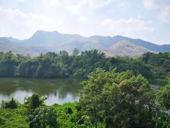 Scenic view of lake and trees against sky