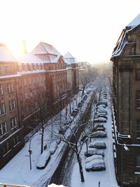 Snow covered houses in city