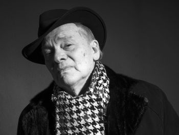 Close-up portrait of man wearing hat