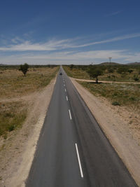 Road amidst landscape against sky