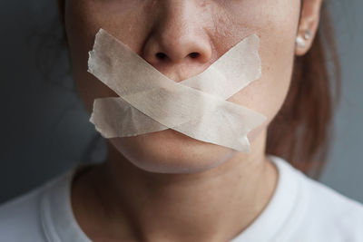 Close-up portrait of woman covering face