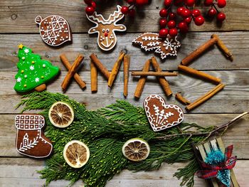 High angle view of christmas decoration and food on wooden table