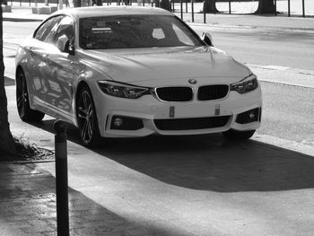 Close-up of car on road