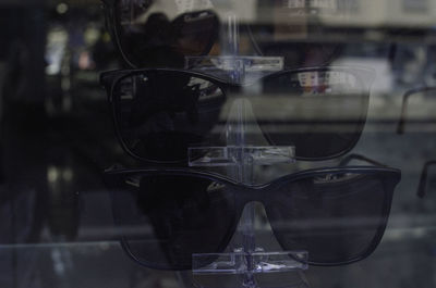 Close-up of sunglasses on glass window